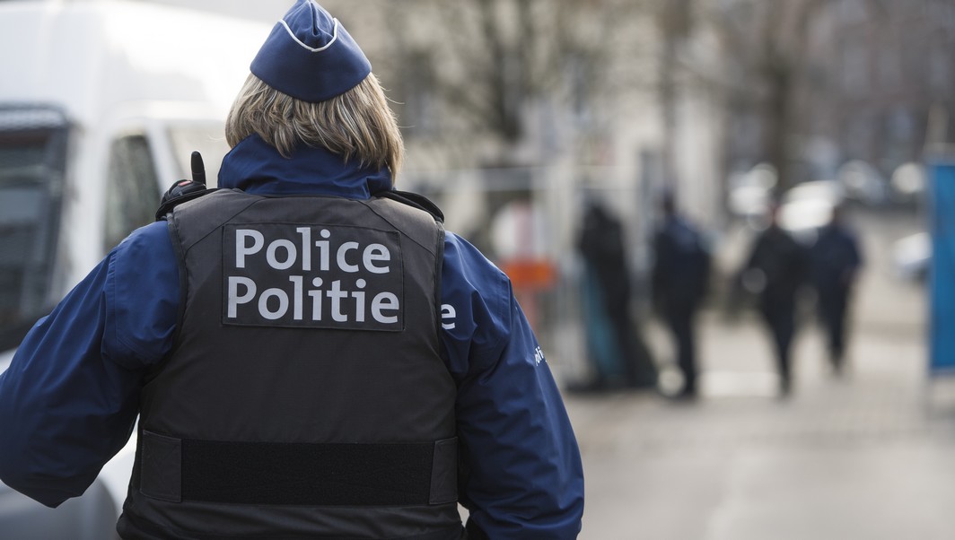 Police officer around the large security perimeter around the Rue Dries - Driesstraat in Forest - Vorst, in Brussels for the reconstruction of the shooting of last year in March 15th, where four police officers were injured and an alleged terrorist, Mohamed Belkaid, was killed, Thursday 26 January 2017. The shooting happened during a search of the apartment, part of the investigation on Paris terrorist attacks. BELGA PHOTO LAURIE DIEFFEMBACQ