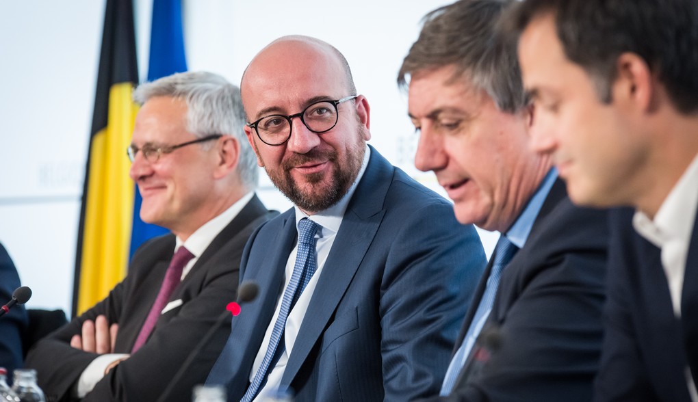 Vice-Prime Minister and Minister of Employment, Economy and Consumer Affairs Kris Peeters, Belgian Prime Minister Charles Michel, Vice-Prime Minister and Interior Minister Jan Jambon and Vice-Prime Minister and Minister of Cooperation Development, Digital Agenda, Telecom and Postal services Alexander De Croo pictured during a press conference regarding the reach of an agreement on the federal budget, Wednesday 26 July 2017 in Brussels. BELGA PHOTO AURORE BELOT