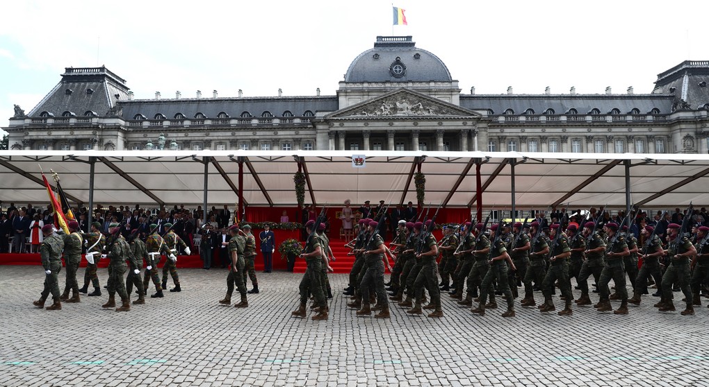 Illustration picture shows military soldiers carrying the Belgian flag during the military parade on the Belgian National Day, in Brussels, Friday 21 July 2017. BELGA PHOTO KURT DESPLENTER